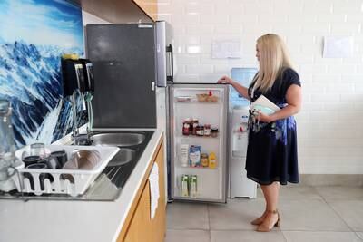 Ms Fitzgibbons checking the fridge in the girls' boarding block