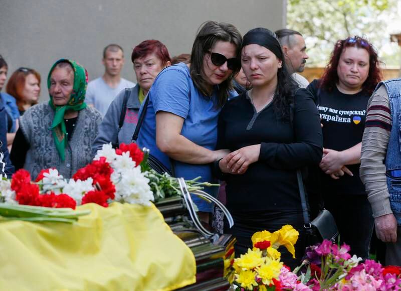 Relatives and friends attend the funeral of a Ukrainian soldier killed in action, in the Odessa region city of Rozdilna. EPA
