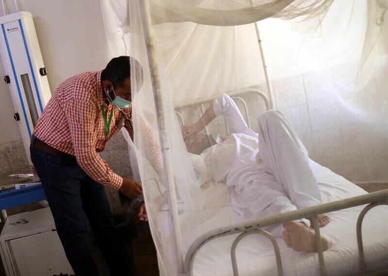 A patient with dengue fever receives treatment in an isolation ward at a hospital in Karachi, Pakistan. EPA