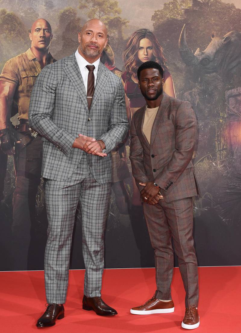 BERLIN, GERMANY - DECEMBER 06:  Dwayne Johnson (L) and Kevin Hart arrive for the German premiere of 'Jumanji: Willkommen im Dschungel' at Sony Center on December 6, 2017 in Berlin, Germany.  (Photo by Matthias Nareyek/Getty Images for Sony Pictures)