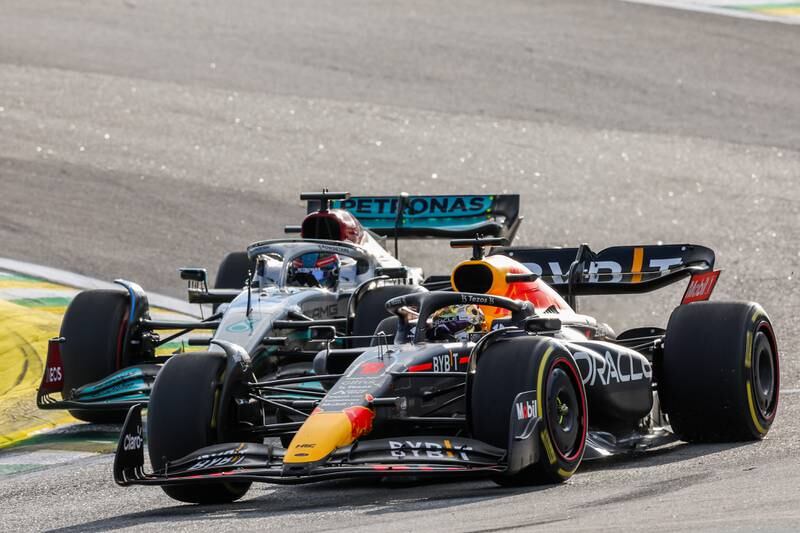 George Russell attacks Max Verstappen during the sprint race. Getty