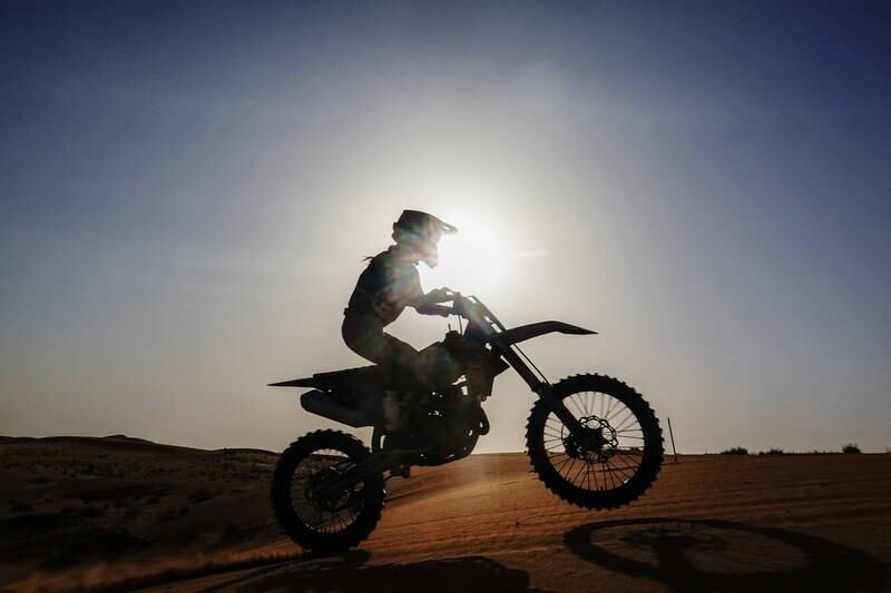Martinette van Vuuren steers her bike through the desert sands of Dubai.