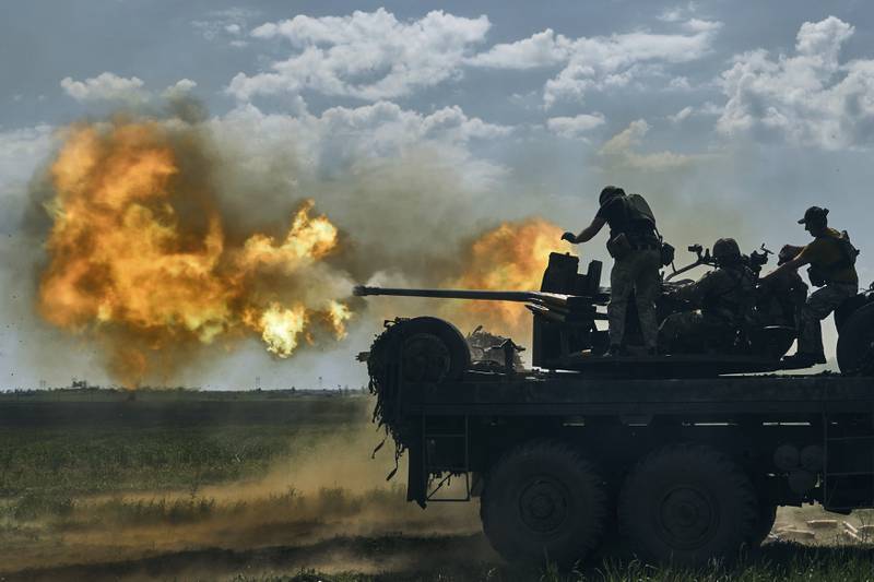 Ukrainian soldiers fire a cannon on the front line near Bakhmut. AP