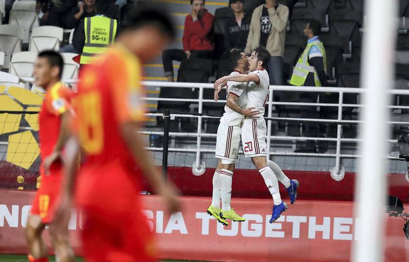 ABU DHABI , UNITED ARAB EMIRATES , January 24 – 2019 :- Sardar Azmoun ( no 20 in white Iran ) celebrating after scoring the 2nd goal during the AFC Asian Cup UAE 2019 football quarter final match between China vs Iran held at Mohammed Bin Zayed Stadium in Abu Dhabi. ( Pawan Singh / The National ) For News/Sports