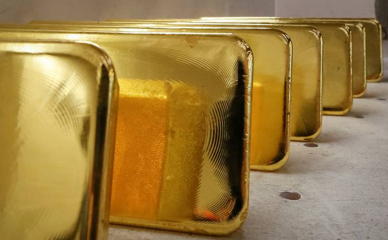 Newly cast ingots of 99. 99% pure gold stored at Krastsvetmet non-ferrous metals plant in Krasnoyarsk, Russia. Reuters