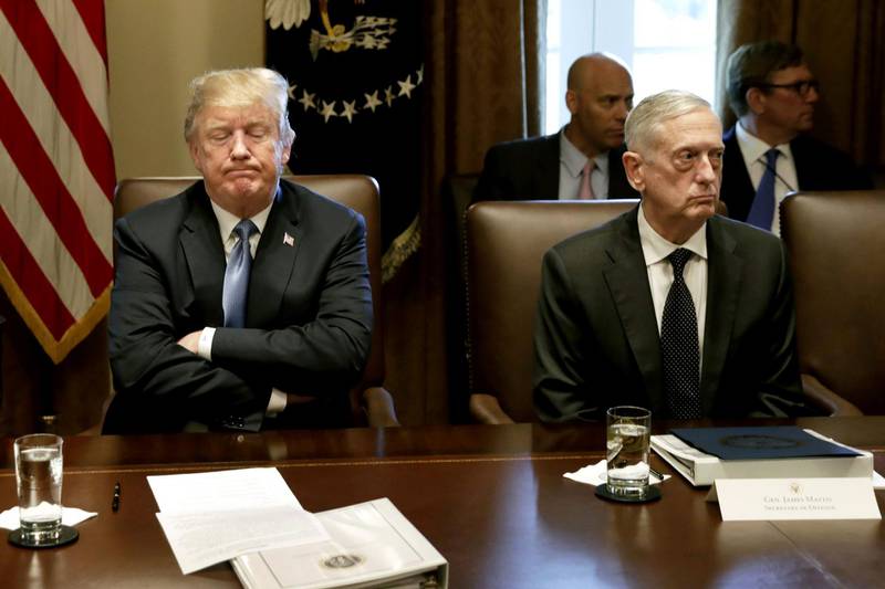 FILE: U.S. President Donald Trump, left, pauses while speaking as James Mattis, US secretary of defense, listens during a Cabinet meeting at the White House in Washington, D.C., U.S., on Thursday, June 21, 2018. Defense Secretary Jim Mattis announced his resignation on Thursday, citing differences over policy with Donald Trump, a day after the president abruptly called for the withdrawal of American forces from Syria. Trump’s cabinet and cabinet-level positions have seen far more resignations and dismissals than other recent administrations. Our gallery pulls together Trump's top White House aides that have departed or announced their departure, Bannon, Bossert, Cohn, Flynn, Hicks, Manigault, Mcfarland, McGahn, McMaster, Powell, Priebus, Scaramucci, Short, Spicer, Sessions, Kelly and Mattis. Photographer: Yuri Gripas/Bloomberg
