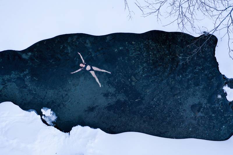 An aerial view of a woman bathing in an icy lake near Yuzhno-Sakhalinsk on Sakhalin Island in Russia's Far East. Some Russians observe the Orthodox Christian feast day of Epiphany by immersing in freezing water through holes cut through the ice of lakes and rivers. AP Photo