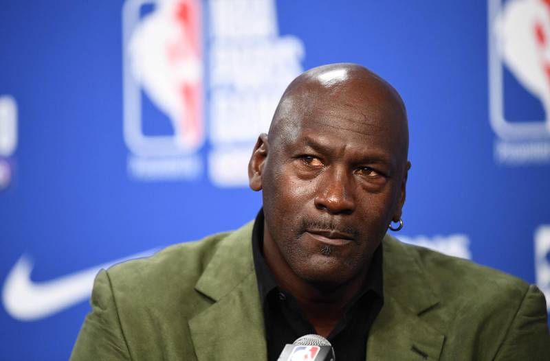 (FILES) In this file photo taken on January 24, 2020 former NBA star and owner of Charlotte Hornets team Michael Jordan looks on as he addresses a press conference ahead of the NBA basketball match between Milwaukee Bucks and Charlotte Hornets at The AccorHotels Arena in Paris. Michael Jordan said June 5, 2020, he is making a record $100 million donation to groups fighting for racial equality and social justice amid a wave of protests across the United States. / AFP / FRANCK FIFE
