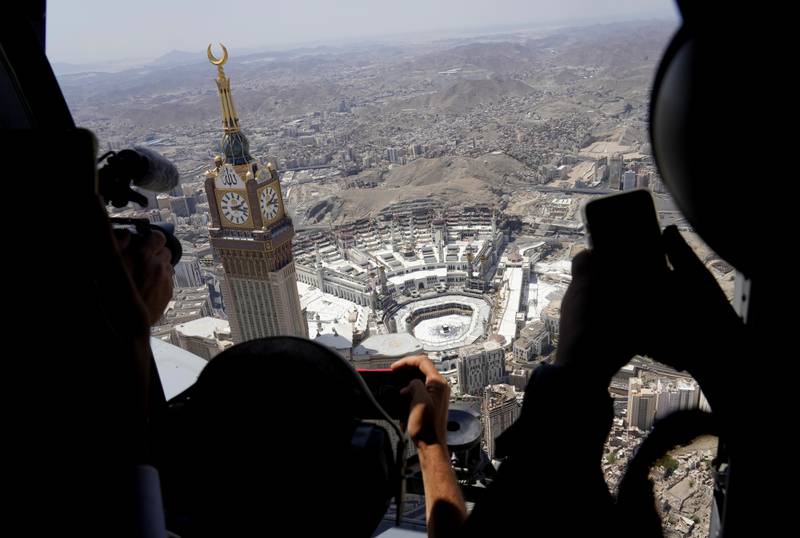 Reporters fly over the Grand Mosque. AP