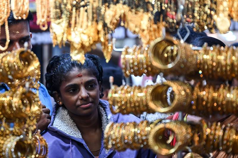 A woman shops for fancy jewellery in Chennai. AFP