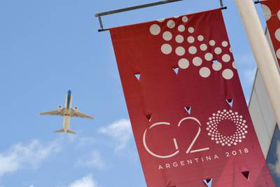 A jet liner flies over the G20 summit venue. AP