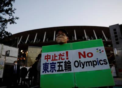 A protester demanding cancelling of Tokyo 2020 Olympic Games. Reuters