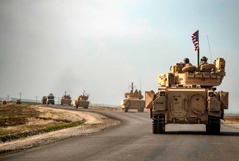 US soldiers in tanks patrol an area near Syria's north-eastern Semalka border crossing with Iraq's Kurdish autonomous territory. AFP
