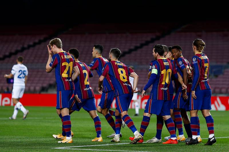 Lionel Messi of Barcelona celebrates with his teammates after scoring his side's first goal. Getty
