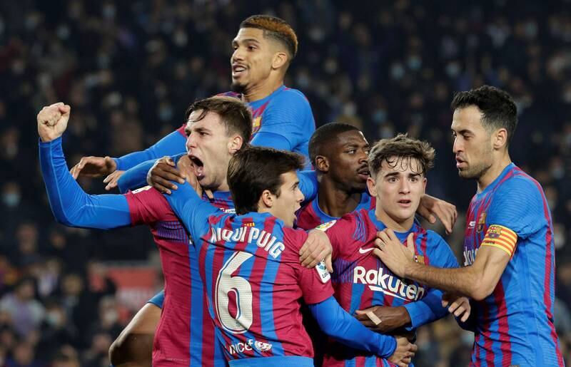 FC Barcelona players celebrate their 3-2 lead during the Spanish LaLiga soccer match between FC Barcelona and Elche CF in Barcelona, Spain, 18 December 2021.   EPA / Quique Garcia