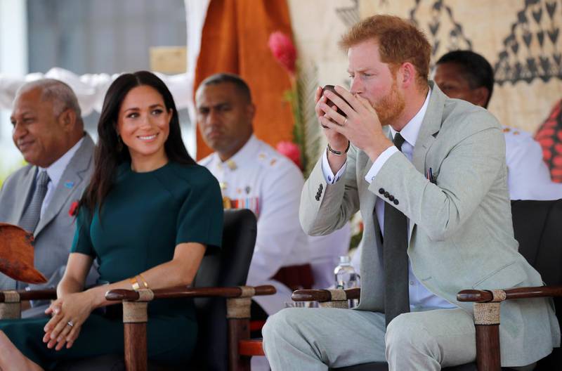 Britain's Prince Harry and Meghan, Duchess of Sussex, attend a ceremony at Nadi airport. Reuters