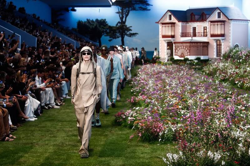 Models present creations from the spring/summer 2023 men's collection by designer Kim Jones for Dior Homme during Paris Fashion Week. EPA
