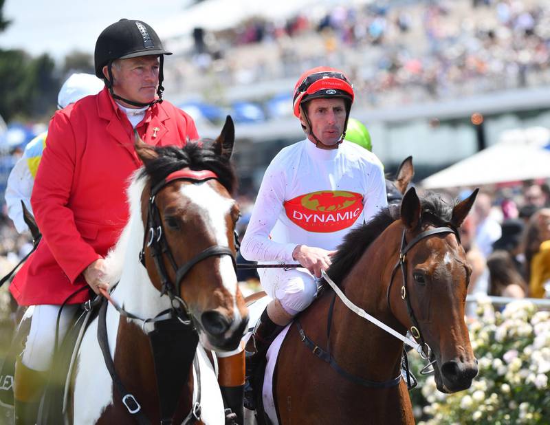 Nash Rawiller, right, returns to scale after riding Teleplay to victory in the Jim Beam Black Stakes. EPA