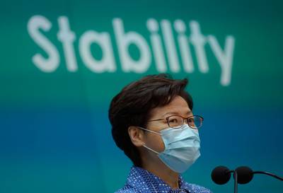 Hong Kong Chief Executive Carrie Lam listens to reporters' questions during a press conference in Hong Kong, Tuesday, May 26, 2020. Lam tried again Tuesday to defend a new national security law that China's parliament is going to impose on Hong Kong. (AP Photo/Vincent Yu)