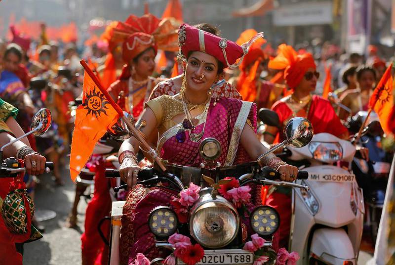 Women dressed in traditional costumes ride motorbikes as they attend celebrations to mark the Gudi Padwa festival, the beginning of the New Year for Maharashtrians, in Mumbai, India. Shailesh Andrade / Reuters