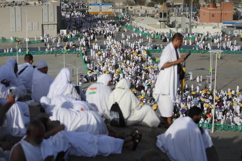 Pilgrims climb Gebel Rahmah (Mount of Mercy) where the Prophet Mohammed gave his last sermon, as people congregate on the plains of Arafat. EPA