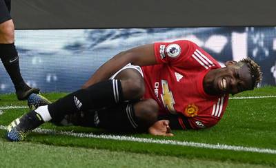 United's Paul Pogba after picking up a knock during the game. Reuters