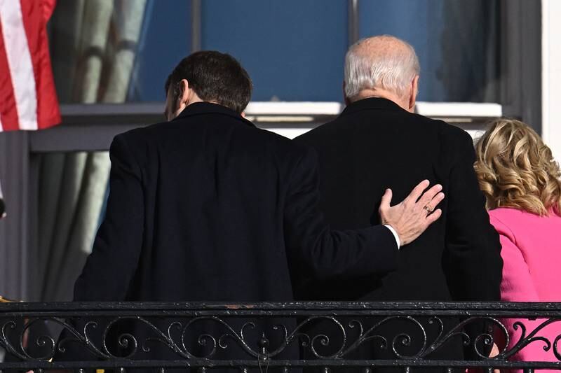 US President Joe Biden and French President Emmanuel Macron take part in a welcoming ceremony for Macron at the White House in Washington, on December 1, 2022. AFP
