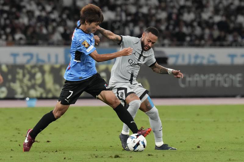 PSG attacker Neymar battles for the ball with Kawasaki Flontale's Shintaro Kurumaya. AP