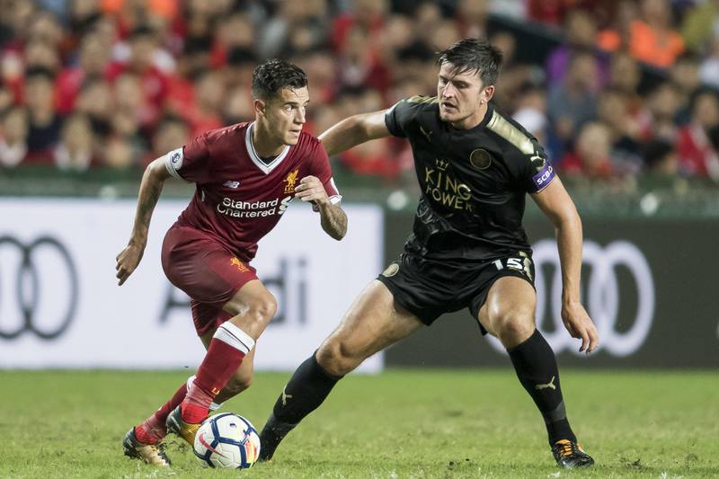HONG KONG, HONG KONG - JULY 22: Liverpool FC midfielder Philippe Coutinho (L) competes for the ball with Leicester City FC defender Harry Maguire during the Premier League Asia Trophy match between Liverpool FC and Leicester City FC at Hong Kong Stadium on July 22, 2017 in Hong Kong, Hong Kong. (Photo by Victor Fraile/Getty Images)