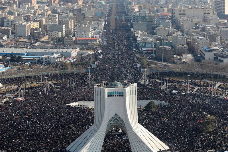 Iranian mourners taking part in a funeral procession in Tehran for Qassem Suleimani. AFP