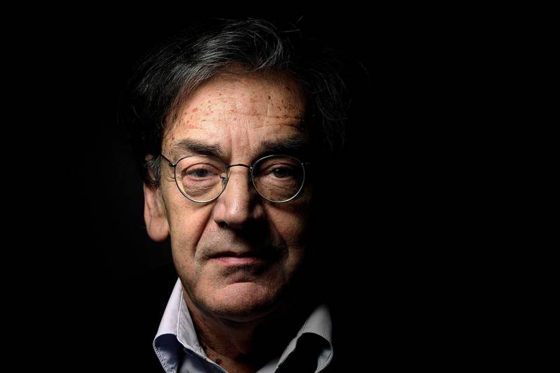 (FILES) In this file photo taken on June 16, 2015 French writer and philosopher Alain Finkielkraut poses for a photograph at his home in Paris.     French writer and philosopher Alain Finkielkraut was verbally assaulted and whistled on February 16, 2019 by Yellow Vest (Gilets Jaunes) demonstrators during the 14th consecutive week of nationwide Yellow Vest (Gilets Jaunes) movement protests against the French President's policies and his top-down style of governing, high cost of living, government tax reforms and for more "social and economic justice." / AFP / Joël SAGET
