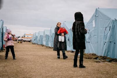 Refugees without immediate plans to move further inland can stay the night in tents set up on Moldova's side of the border. Erin Clare Brown for The National
