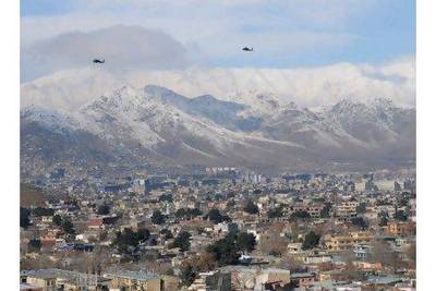 US helicopters fly over the Afghan capital Kabul. A reader supports a proposal by a former US ambassador to India to partition Afghanistan along tribal lines. Shan Marai / AFP