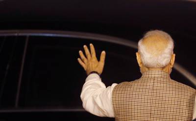 India's Prime Minister Narendra Modi waves as Saudi Arabia's Crown Prince Mohammed bin Salman leaves the airport after his arrival in New Delhi, India, on February 19, 2019. Reuters