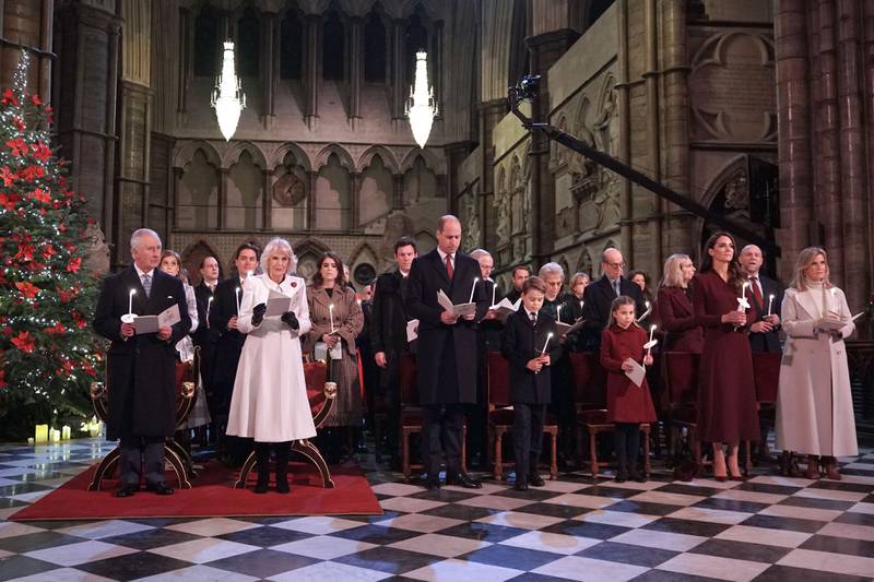 Britain's King Charles III, Camilla, Queen Consort, Prince William, Prince of Wales, Prince George, Princess Charlotte, Catherine, Princess of Wales, and Sophie, Countess of Wessex attend the Together At Christmas carol service at Westminster Abbey, in London. AFP