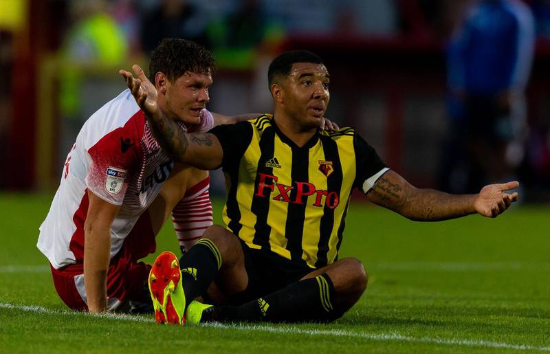 STEVENAGE, ENGLAND - JULY 27:   Troy Deeney of Watford FC and Luther Wildin of Stevenage react during the pre-season friendly between Stevenage and Watford at The Lamex Stadium on July 27, 2018 in Stevenage, England. (Photo by Paul Harding/Getty Images)