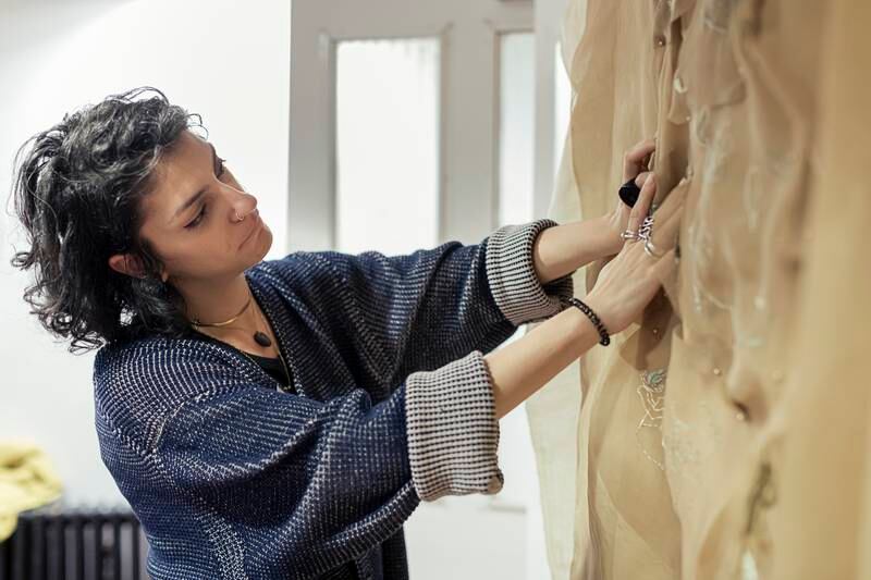 Nour Hage works on her Kheit exhibition, which will go on display at Leighton House in London. Photo: Hydar Dewachi