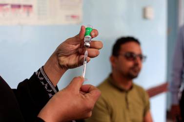 A man waits to receive the AstraZeneca vaccine against Covid-19 at a medical centre in Taez, Yemen. Reuters 