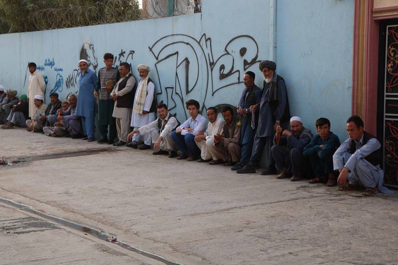 Afghan voters wait to cast their ballot during the presidential elections in Herat, Afghanistan.  EPA