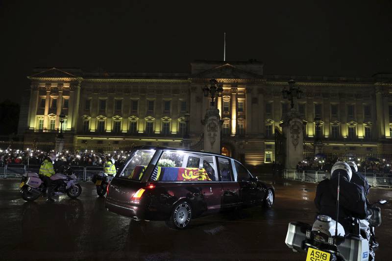 The hearse carrying the coffin of the queen arrives at Buckingham Palace on Tuesday. AP