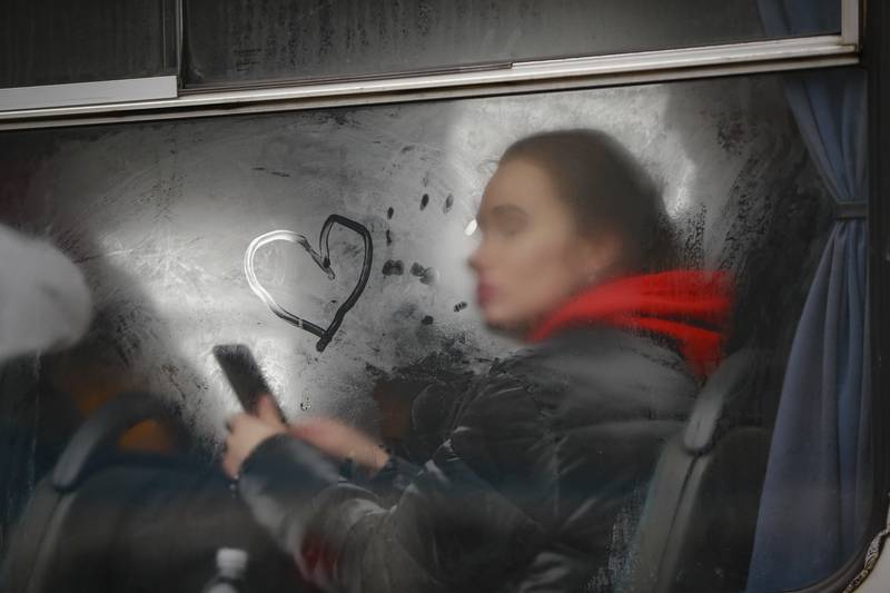 A woman fleeing Ukraine on a bus near the border crossing in Korczowa, Poland. AP Photo