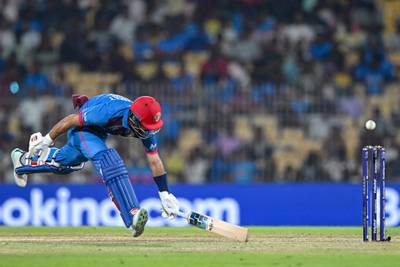 Afghanistan's Rahmat Shah lunges to make his ground. AFP