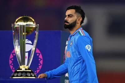 India's Virat Kohli walks past the World Cup trophy. Getty Images