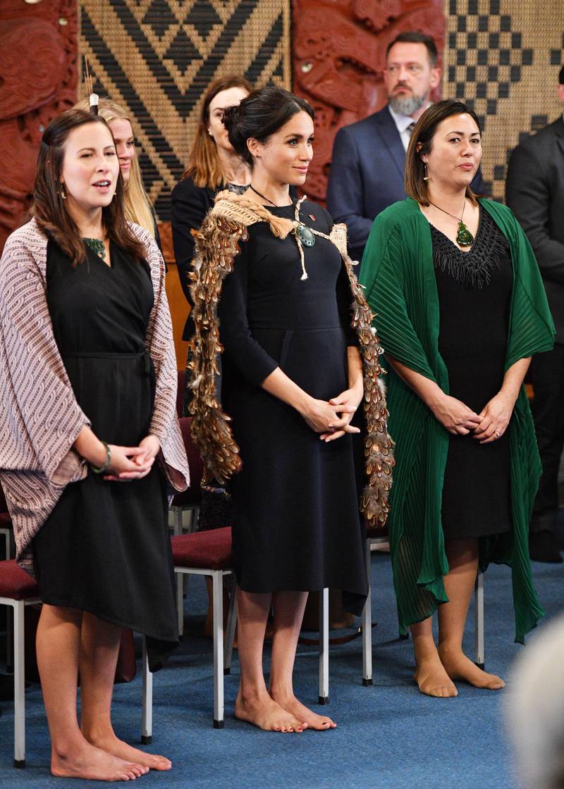 She wore a Stella McCartney dress to visit Te Papaiouru Marae on October 31 in Rotorua, New Zealand. Her korowai (traditional Maori cloak) was made for her by Ngati Whakaue artist Norma Sturley. The artist was inspired by the Duchess of Sussex's coat of arms.