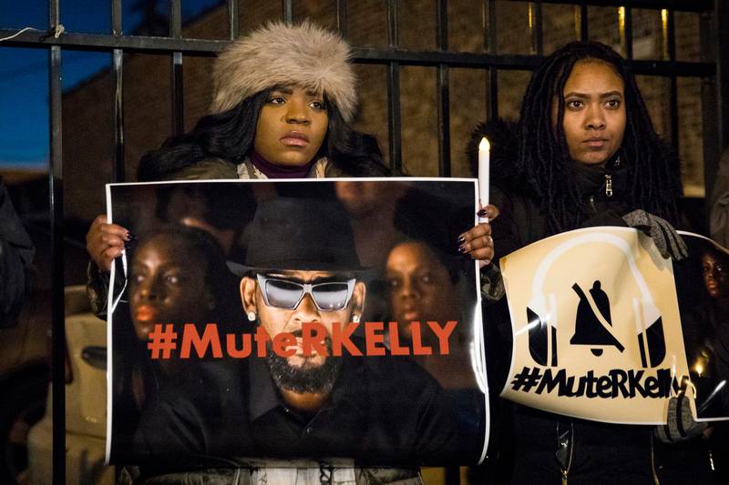 #MuteRKelly supporters protest outside R. Kelly's studio, Wednesday, Jan. 9, 2019 in Chicago. Lifetime's "Surviving R. Kelly" series which aired earlier this month, looks at the singer's history and allegations that he has sexually abused women and girls. Kelly, who turned 52 on Tuesday, has denied wrongdoing. (Ashlee Rezin/Chicago Sun-Times via AP)