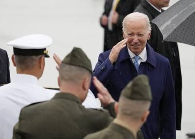 US President Joe Biden salutes troops as he arrives at the Marine Corps Air Station Iwakuni on his way to the G7 leaders' summit in Hiroshima. EPA