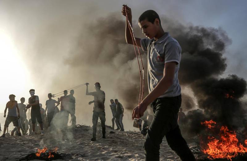 Protesters during clashes near the border. EPA