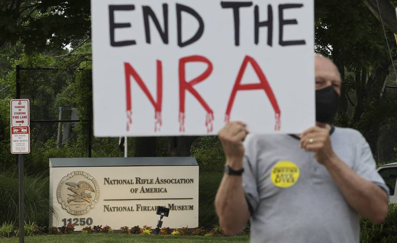 Gun-control advocates hold a vigil outside the National Rifle Association (NRA) headquarters in Fairfax, Virginia. AFP