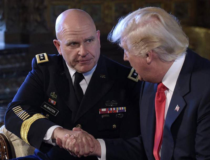 Former pesident Trump shakes hands with Mr McMaster in Palm Beach, Florida. AP