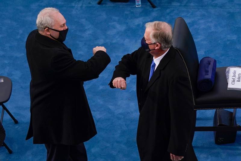 House Minority Whip Steve Scalise, left, greets former vice president Dan Quayle, as they arrive for the inauguration of Joe Biden. AP Photo